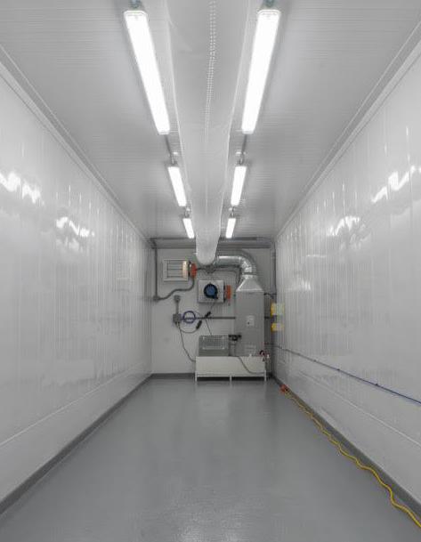 Interior corridor of the fruiting module showing climate-control ductwork and equipment