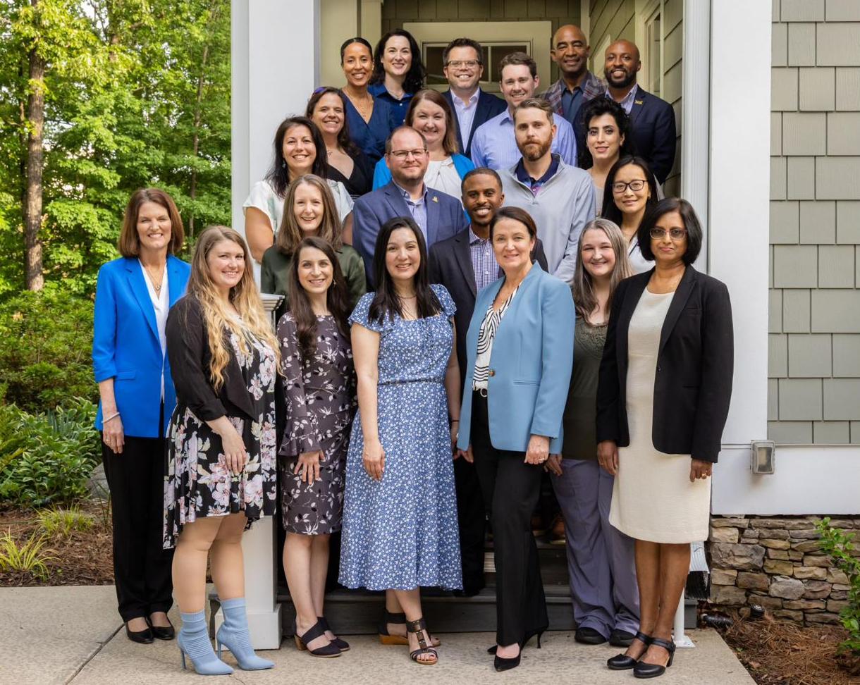 A large group of KSU staff and faculty posing on the steps of a building for the High Impact Leaders Academy